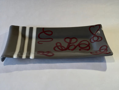 LONG PLATE-GRAY WITH RED SWIRLS AND WHIT STRIPS